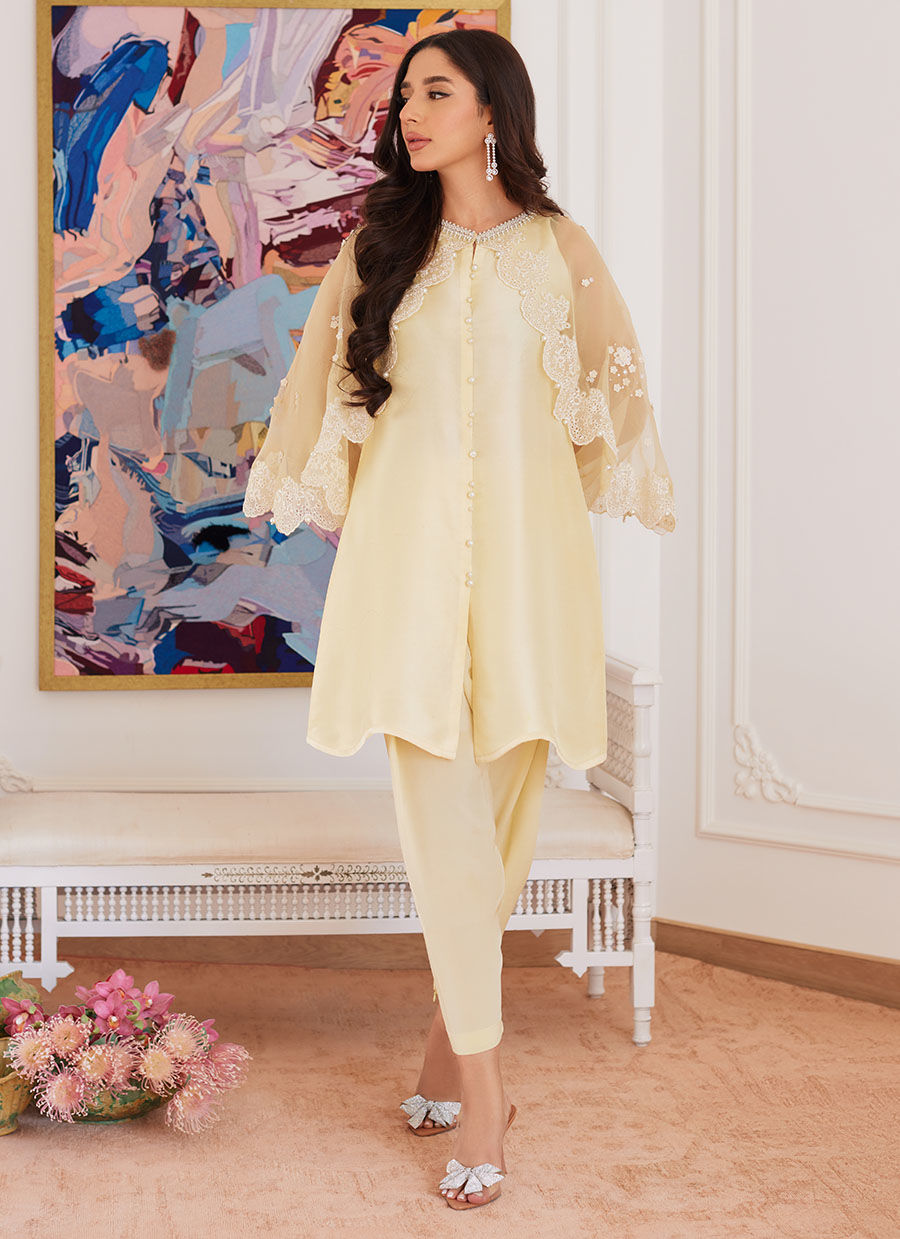 ESMERALDA PASTEL YELLOW RAW SILK SHIRT WITH ATTACHED CAPE- Luna Eid'24 | By Farah Talib Aziz